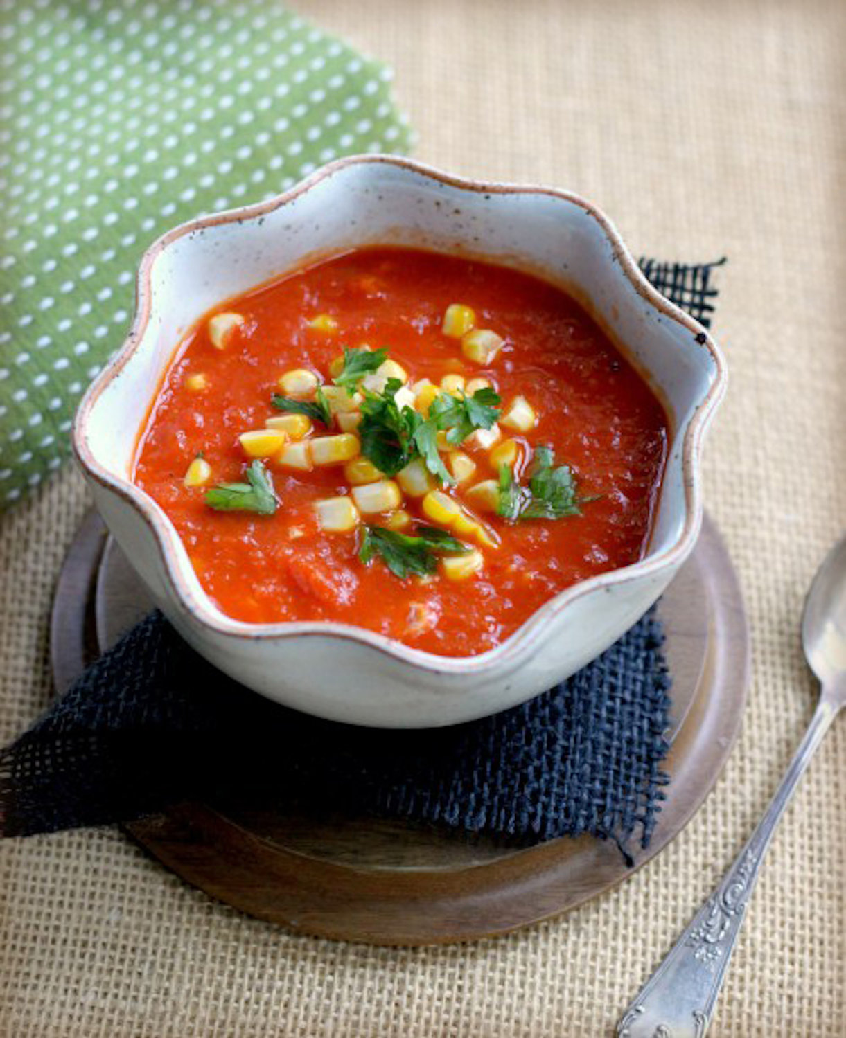 Roasted summer vegetables create a sweet and flavorful base for this soup.